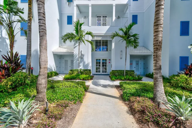 a view of a swimming pool with a table and chairs