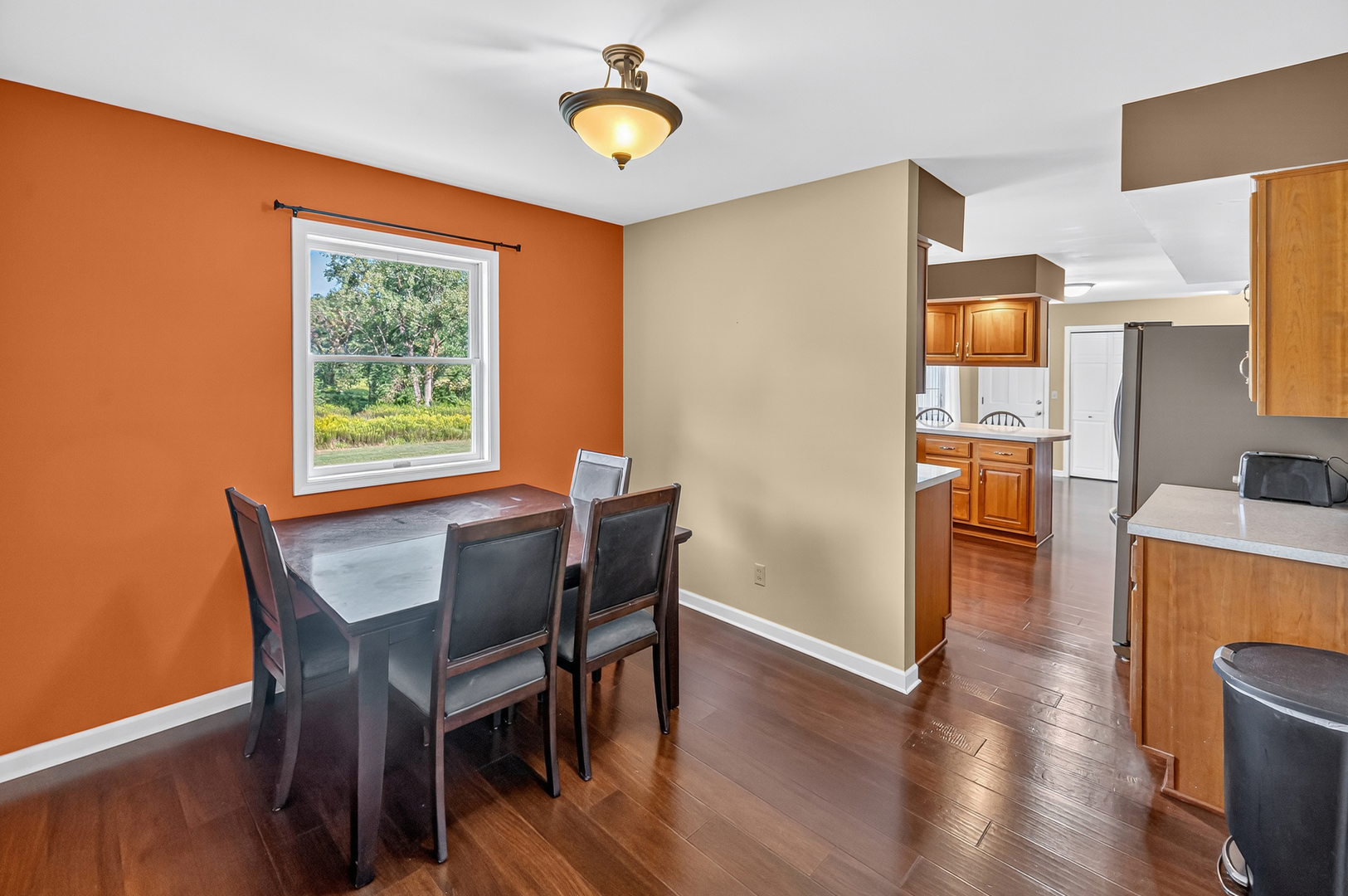 4454 North Prairie View Road Argenta, IL 62501 - Photo 14 of 45 a view of a dining room with furniture and wooden floor
