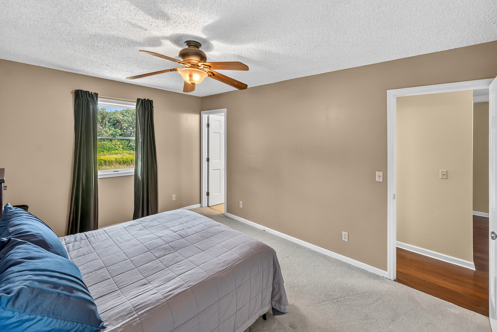 4454 North Prairie View Road Argenta, IL 62501 - Photo 19 of 45 a bedroom with a bed and a chandelier