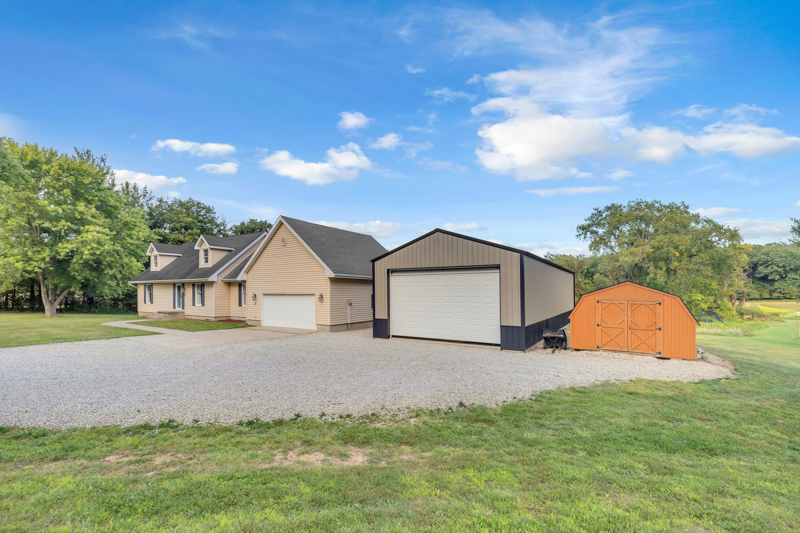 4454 North Prairie View Road Argenta, IL 62501 - Photo 2 of 45 a front view of a house with a yard and garage