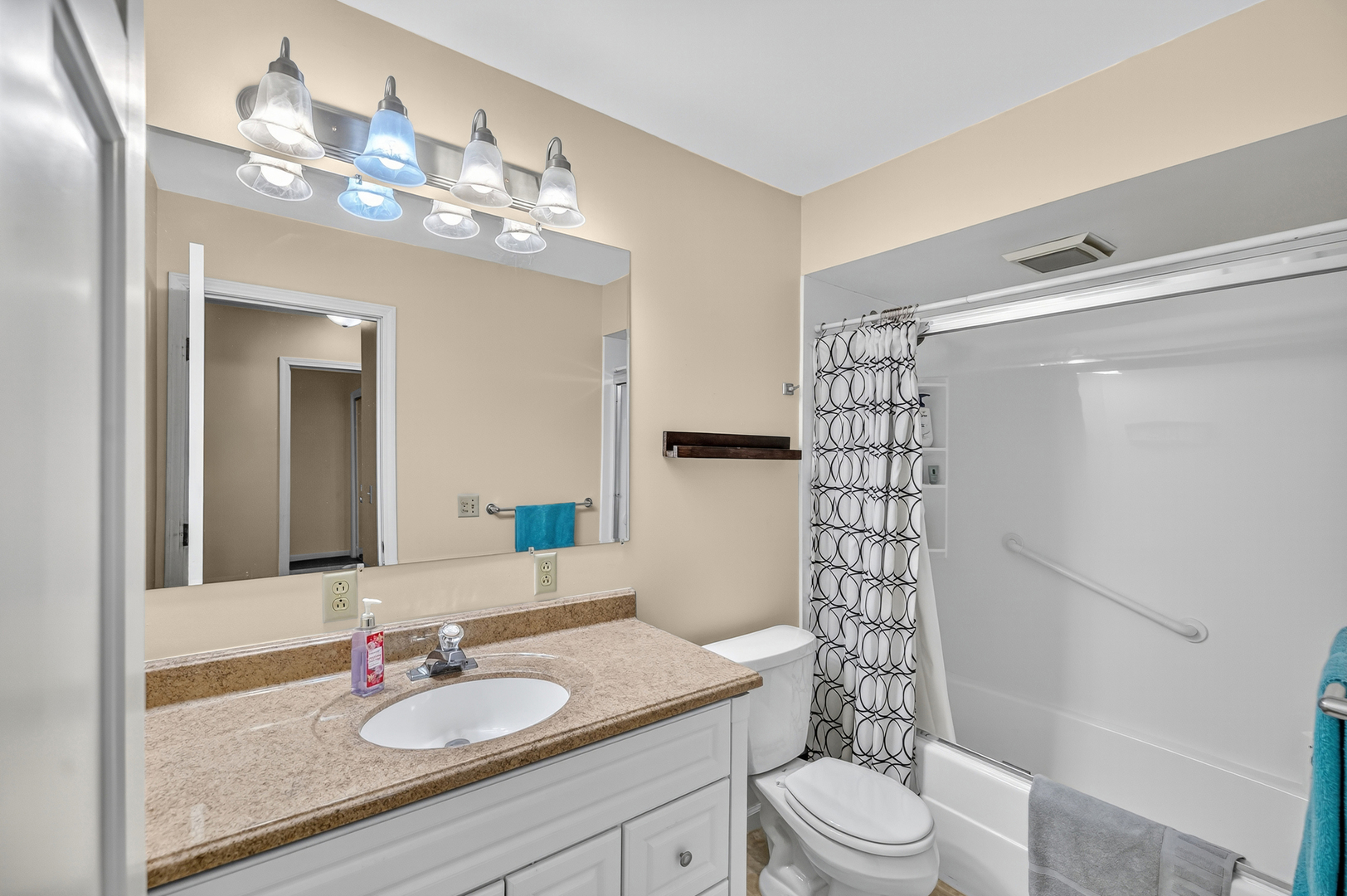 4454 North Prairie View Road Argenta, IL 62501 - Photo 22 of 45 a bathroom with a sink a toilet a mirror a vanity and shower