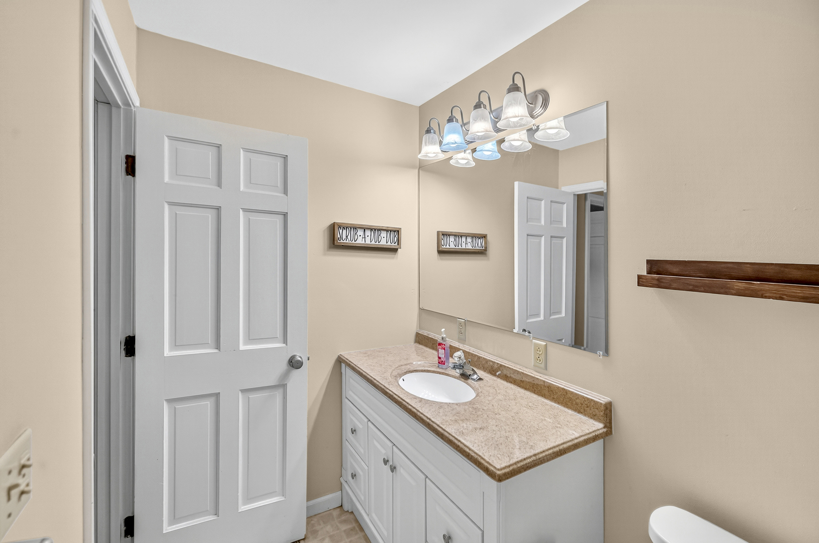 4454 North Prairie View Road Argenta, IL 62501 - Photo 23 of 45 a bathroom with a sink vanity and a mirror