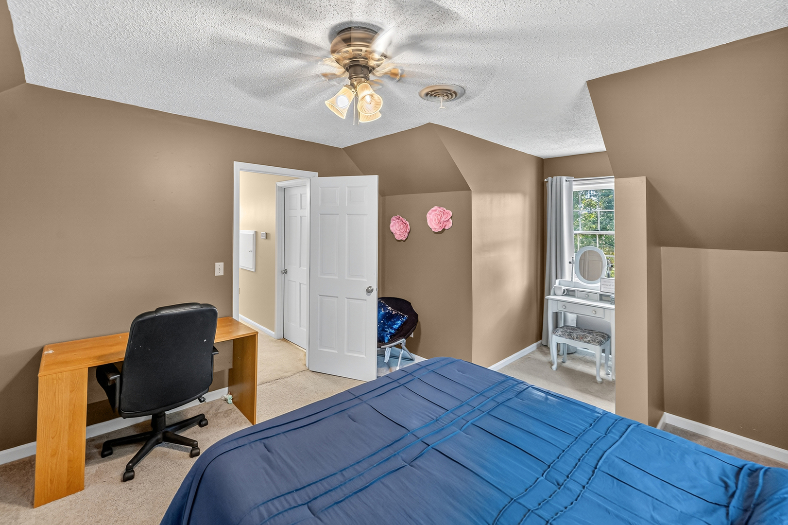 4454 North Prairie View Road Argenta, IL 62501 - Photo 28 of 45 a bedroom with a bed and a chandelier