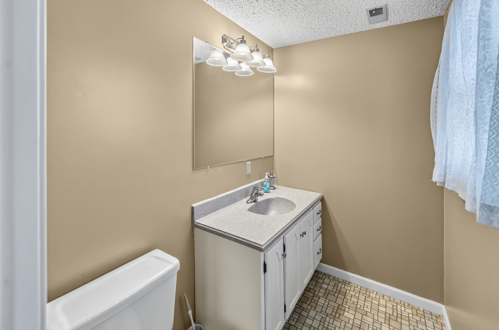 4454 North Prairie View Road Argenta, IL 62501 - Photo 34 of 45 a bathroom with a sink and a mirror