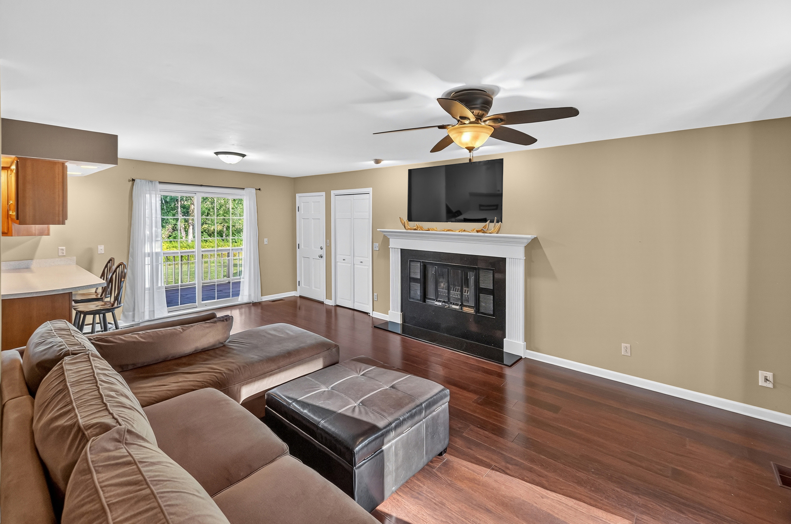 4454 North Prairie View Road Argenta, IL 62501 - Photo 9 of 45 a living room with furniture a flat screen tv and a fireplace