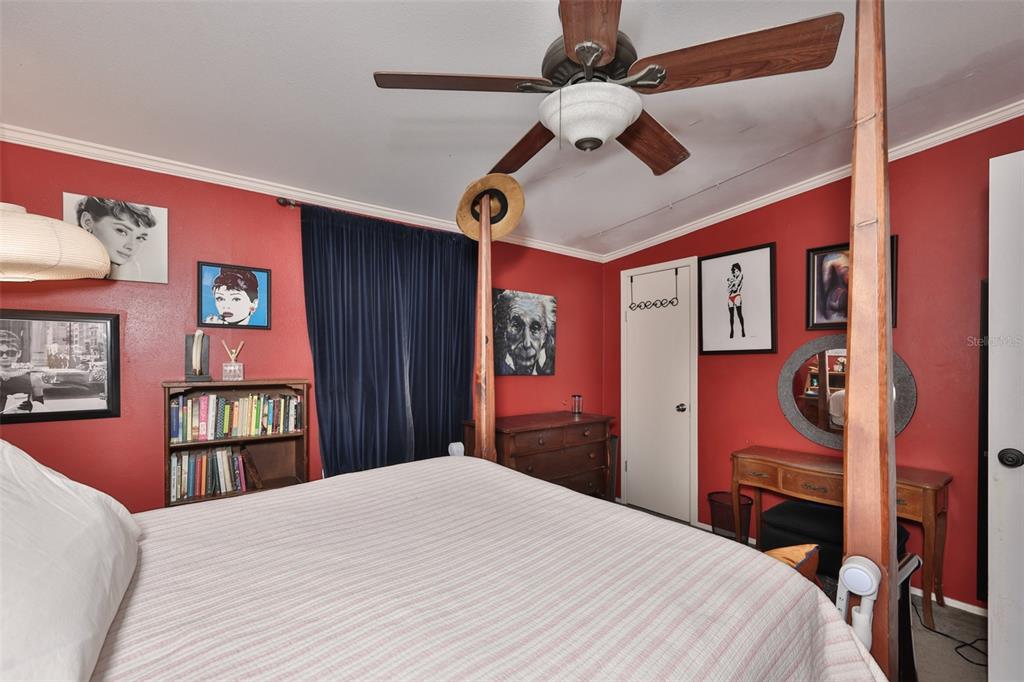 20112 Hobbs Road Wimauma, FL 33598 - Photo 30 of 94 a bedroom with a bed and a dresser