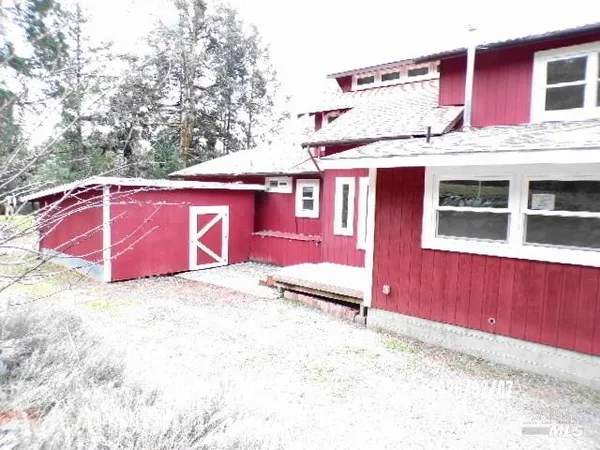 a view of balcony with wooden floor and fence