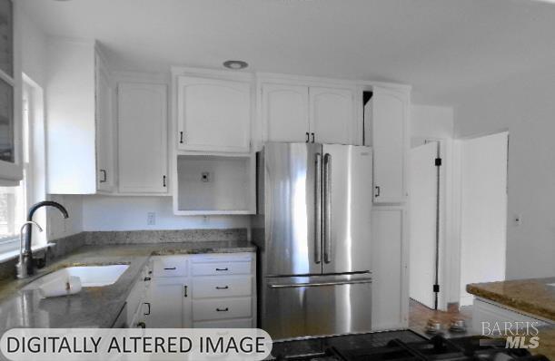 1881 Laytonville Dos Rios Road Laytonville, CA 95454 - Photo 8 of 29 a kitchen with granite countertop a refrigerator and a sink