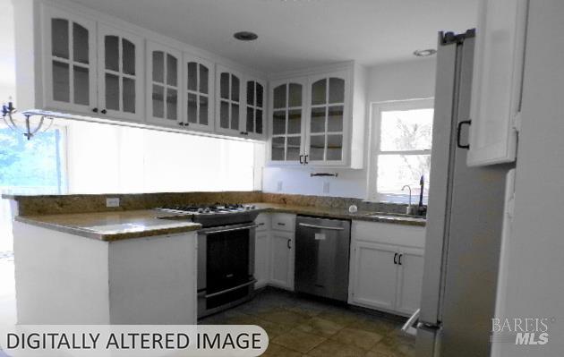 1881 Laytonville Dos Rios Road Laytonville, CA 95454 - Photo 9 of 29 a kitchen with stainless steel appliances granite countertop a stove a sink and a granite counter tops