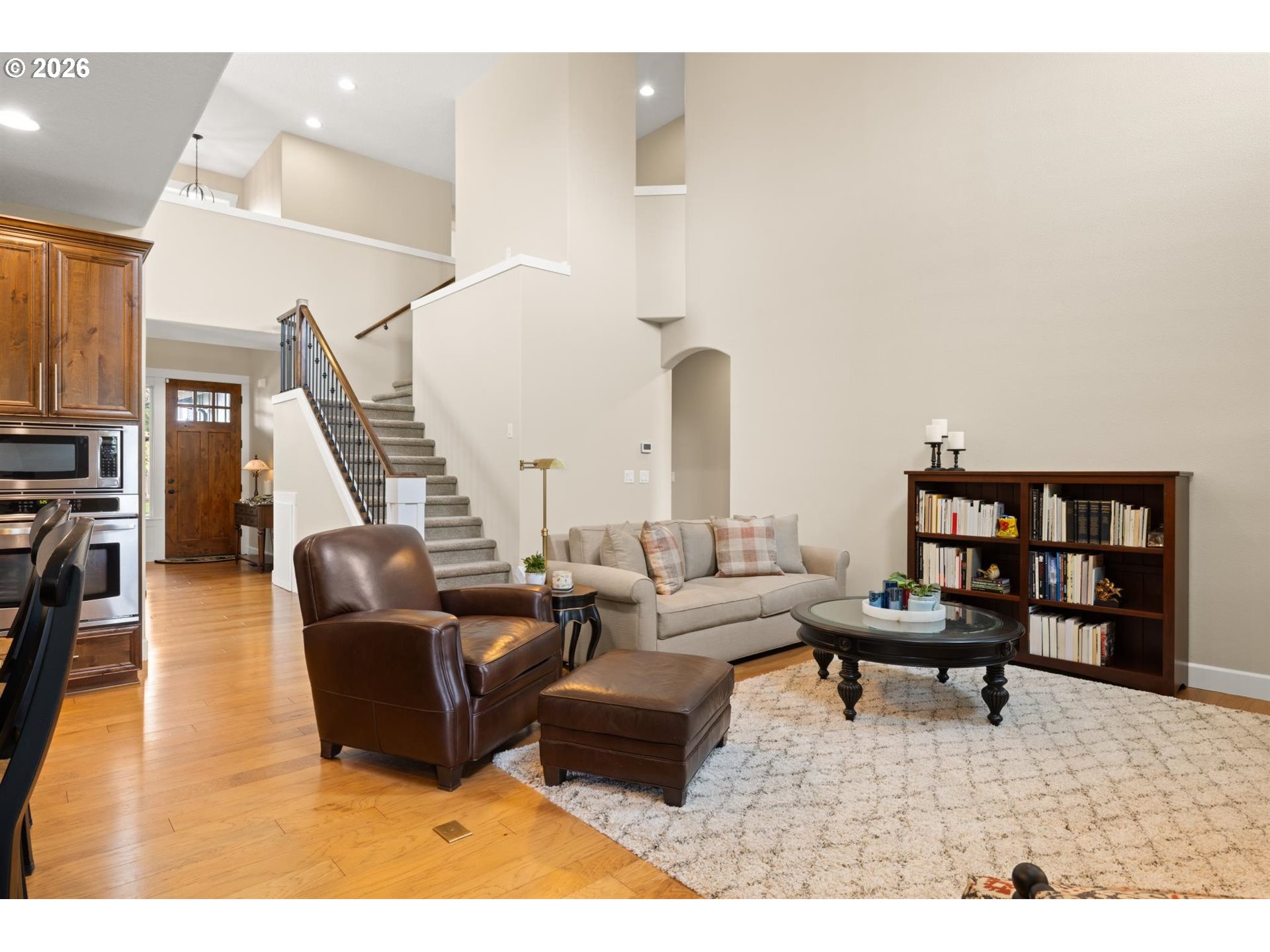 1274 South 15th Way Ridgefield, WA 98642 - Photo 14 of 46 a living room with furniture and a book shelf