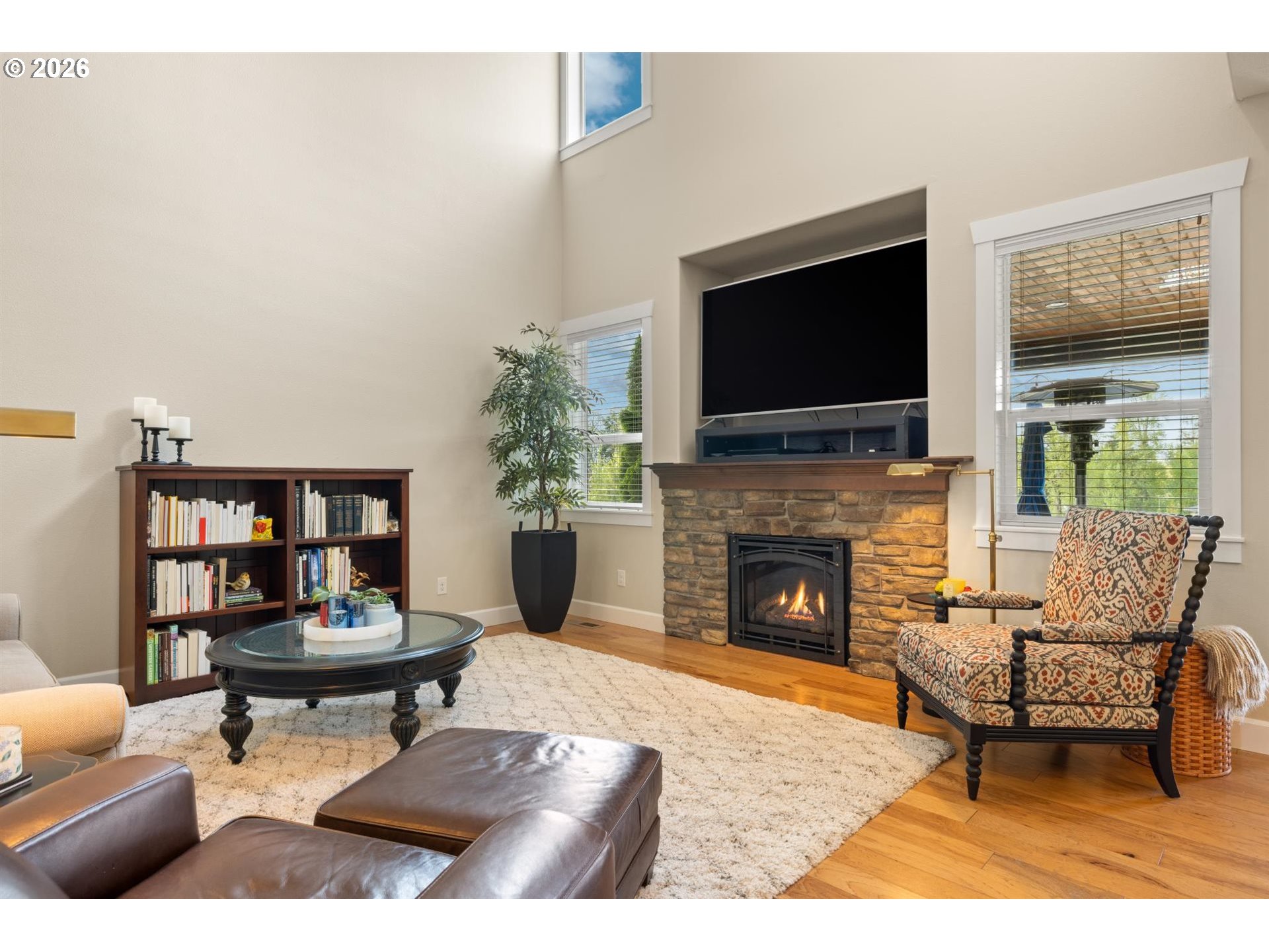 1274 South 15th Way Ridgefield, WA 98642 - Photo 15 of 46 a living room with furniture a flat screen tv and a fireplace