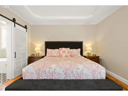 a bedroom with a bed and cabinet