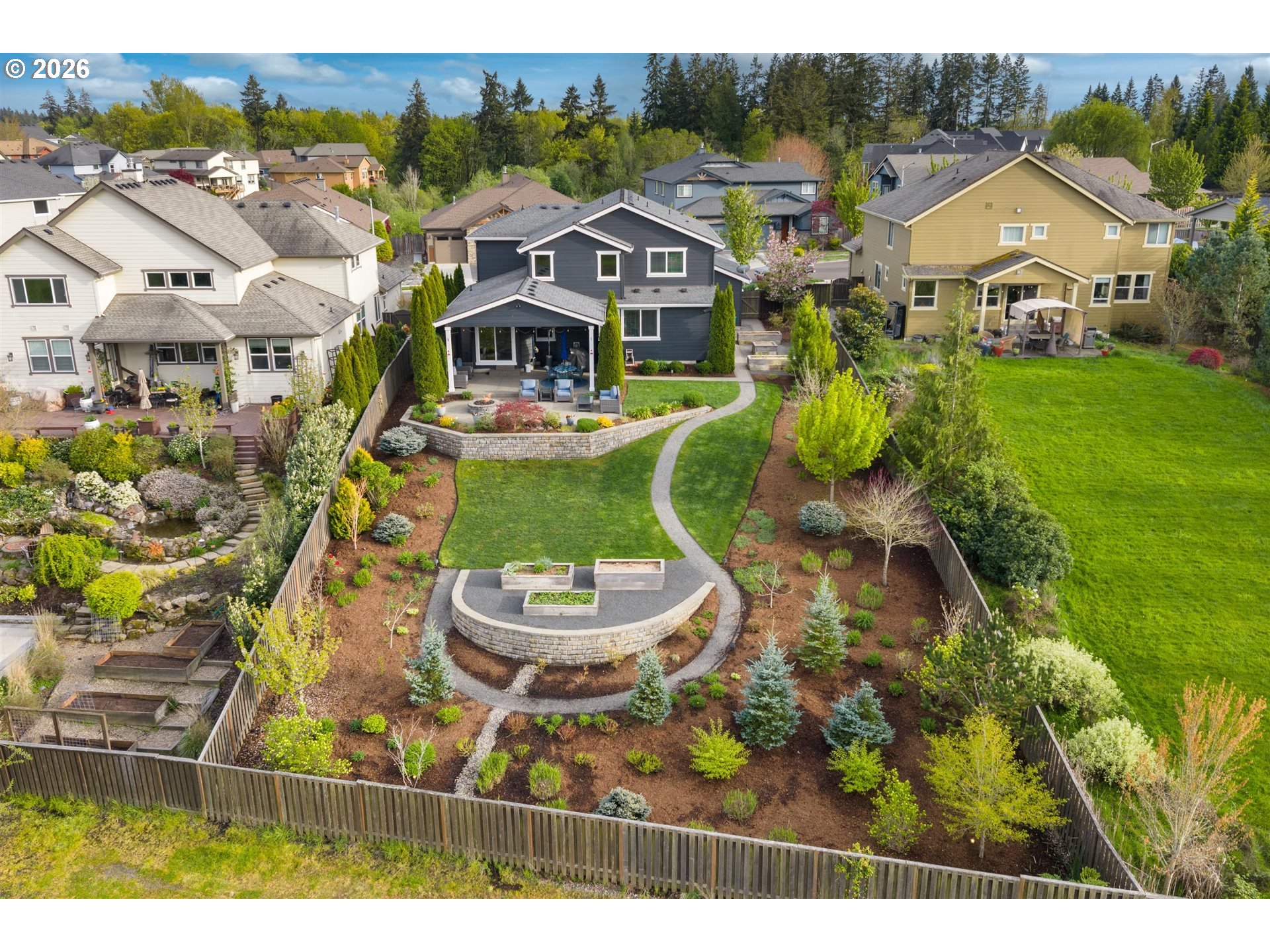 1274 South 15th Way Ridgefield, WA 98642 - Photo 2 of 46 a view of a big house with a big yard and potted plants