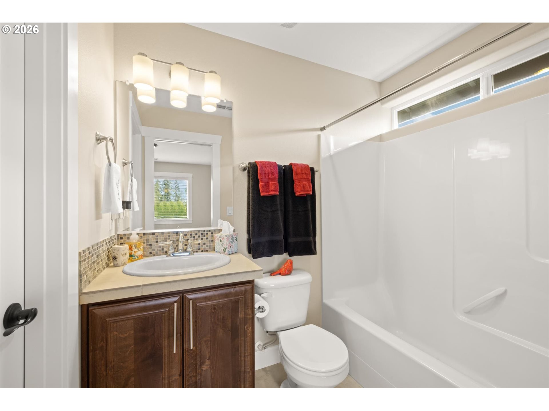 1274 South 15th Way Ridgefield, WA 98642 - Photo 24 of 46 a bathroom with a sink vanity mirror and toilet