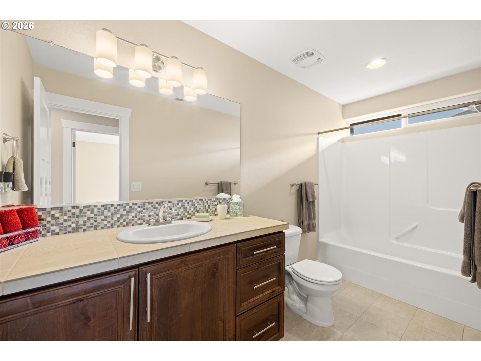 1274 South 15th Way Ridgefield, WA 98642 - Photo 26 of 46 a bathroom with a sink a toilet and shower