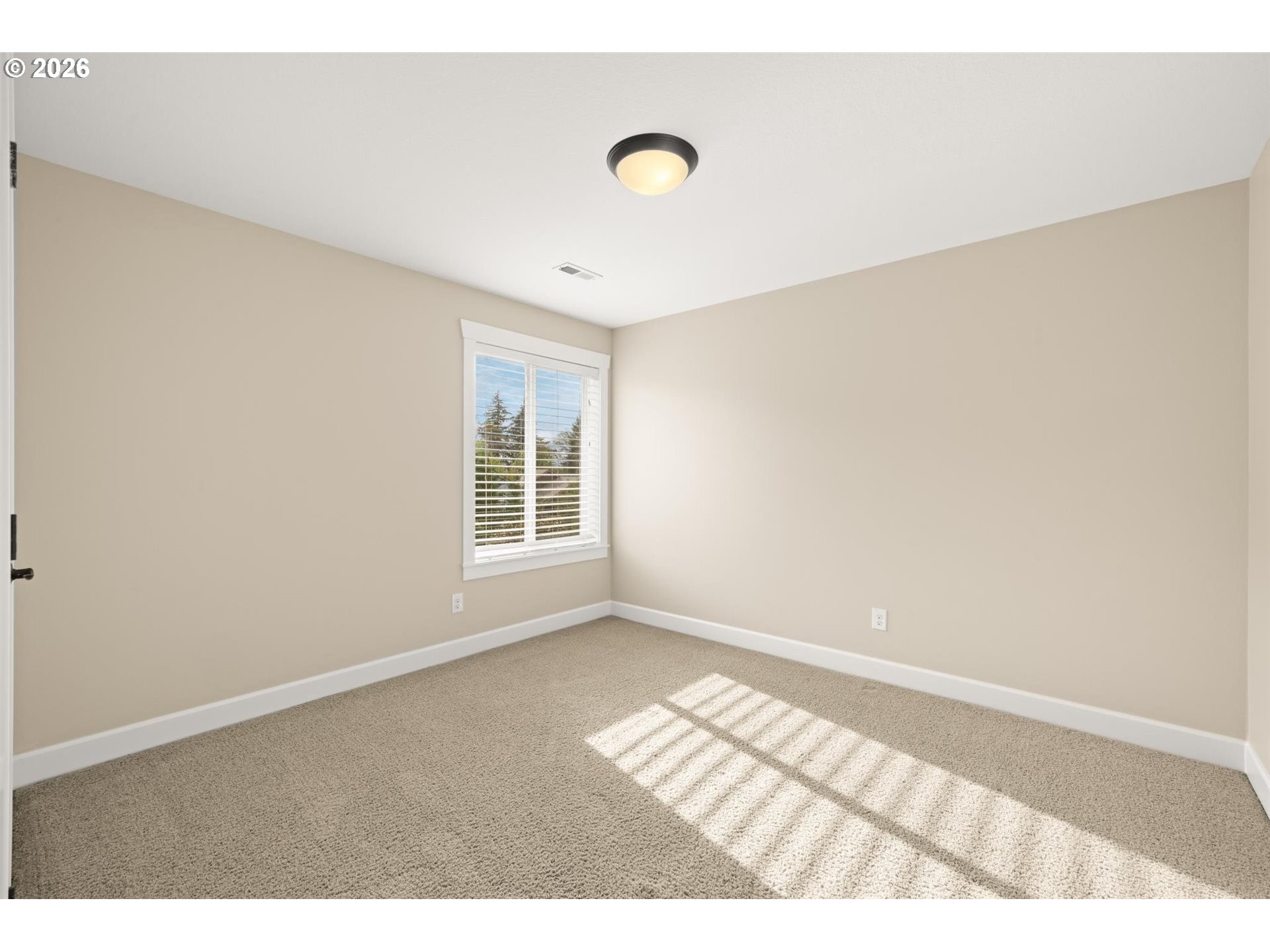 1274 South 15th Way Ridgefield, WA 98642 - Photo 28 of 46 a view of wooden floor and windows in a room