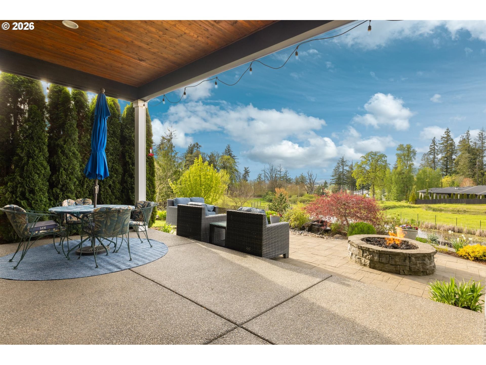 1274 South 15th Way Ridgefield, WA 98642 - Photo 32 of 46 a view of a patio with a dining table and chairs