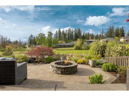a view of house with yard outdoor seating and entertaining space