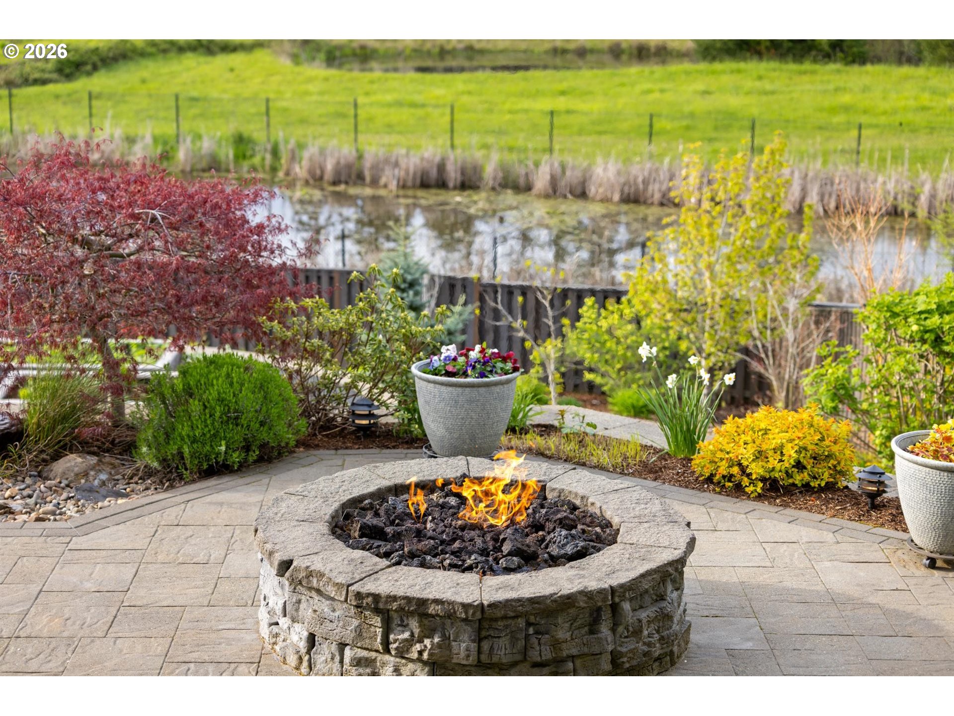 1274 South 15th Way Ridgefield, WA 98642 - Photo 37 of 46 a view of a backyard with plants and swimming pool