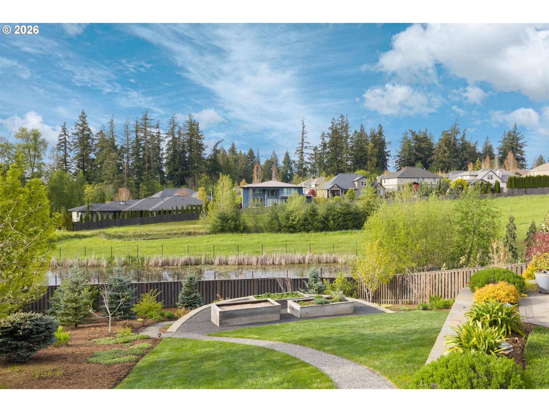 1274 South 15th Way Ridgefield, WA 98642 - Photo 40 of 46 a view of a lake with a building in the background