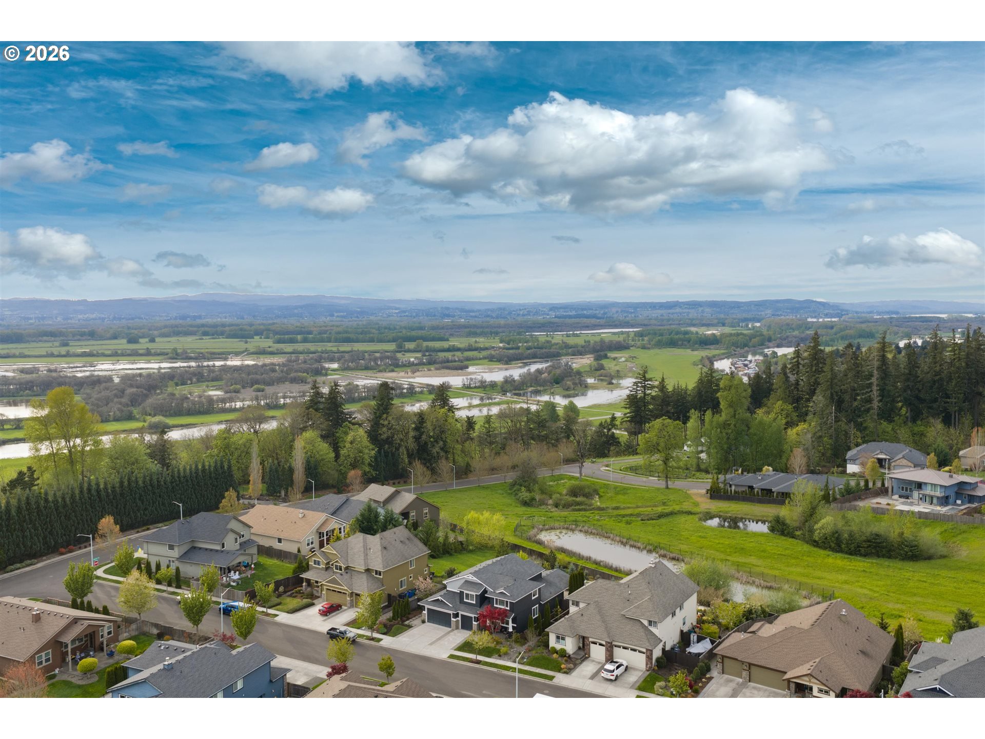 1274 South 15th Way Ridgefield, WA 98642 - Photo 45 of 46 a view of a lake with houses in the back