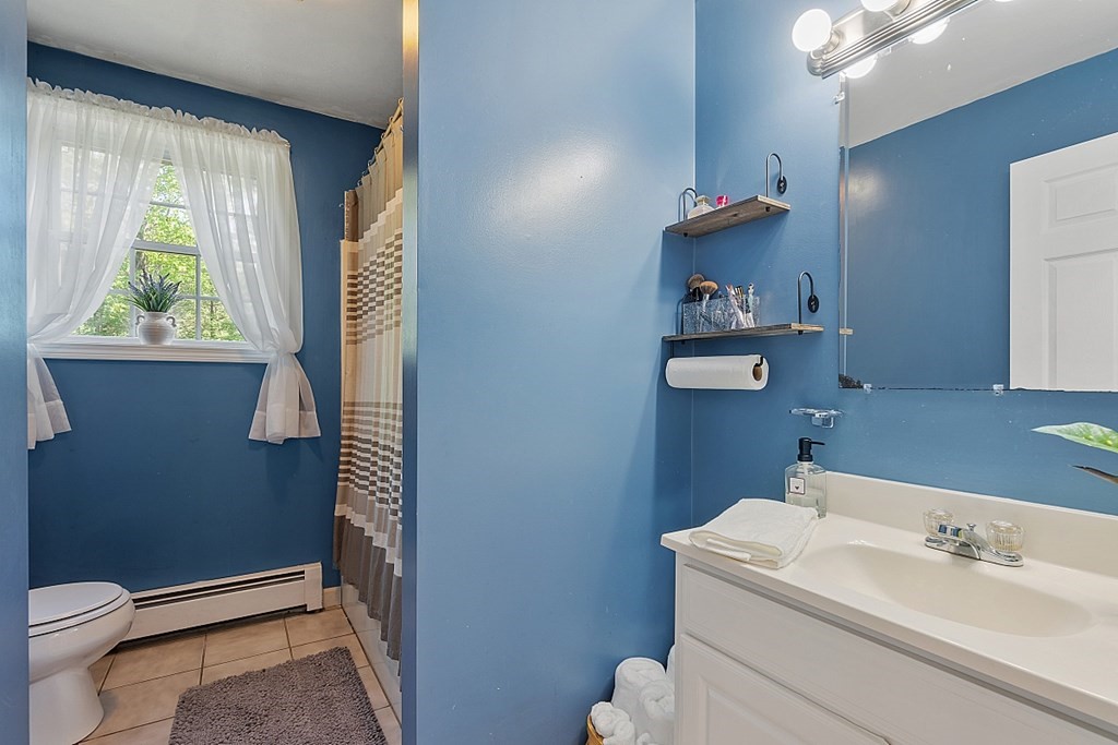 540 Royalston Road Phillipston, MA 01331 - Photo 18 of 38 a bathroom with a toilet a sink and a window