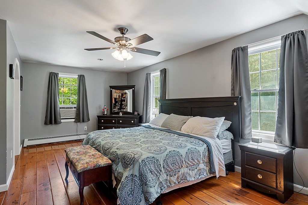 540 Royalston Road Phillipston, MA 01331 - Photo 29 of 38 a bed sitting in a spacious bedroom next to a window