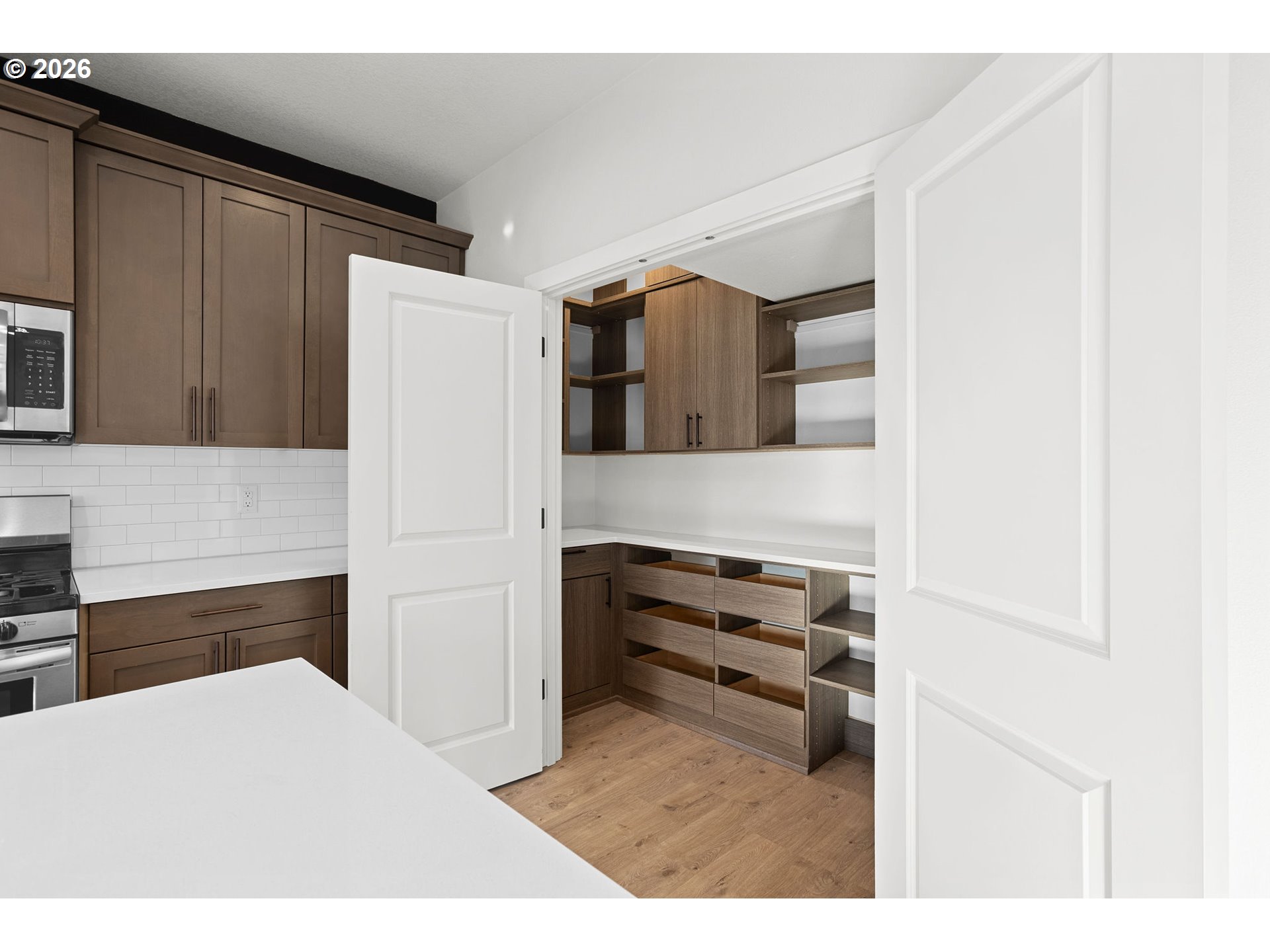 719 Northwest 178th Street Ridgefield, WA 98642 - Photo 18 of 46 a bedroom with a bed and a cabinets