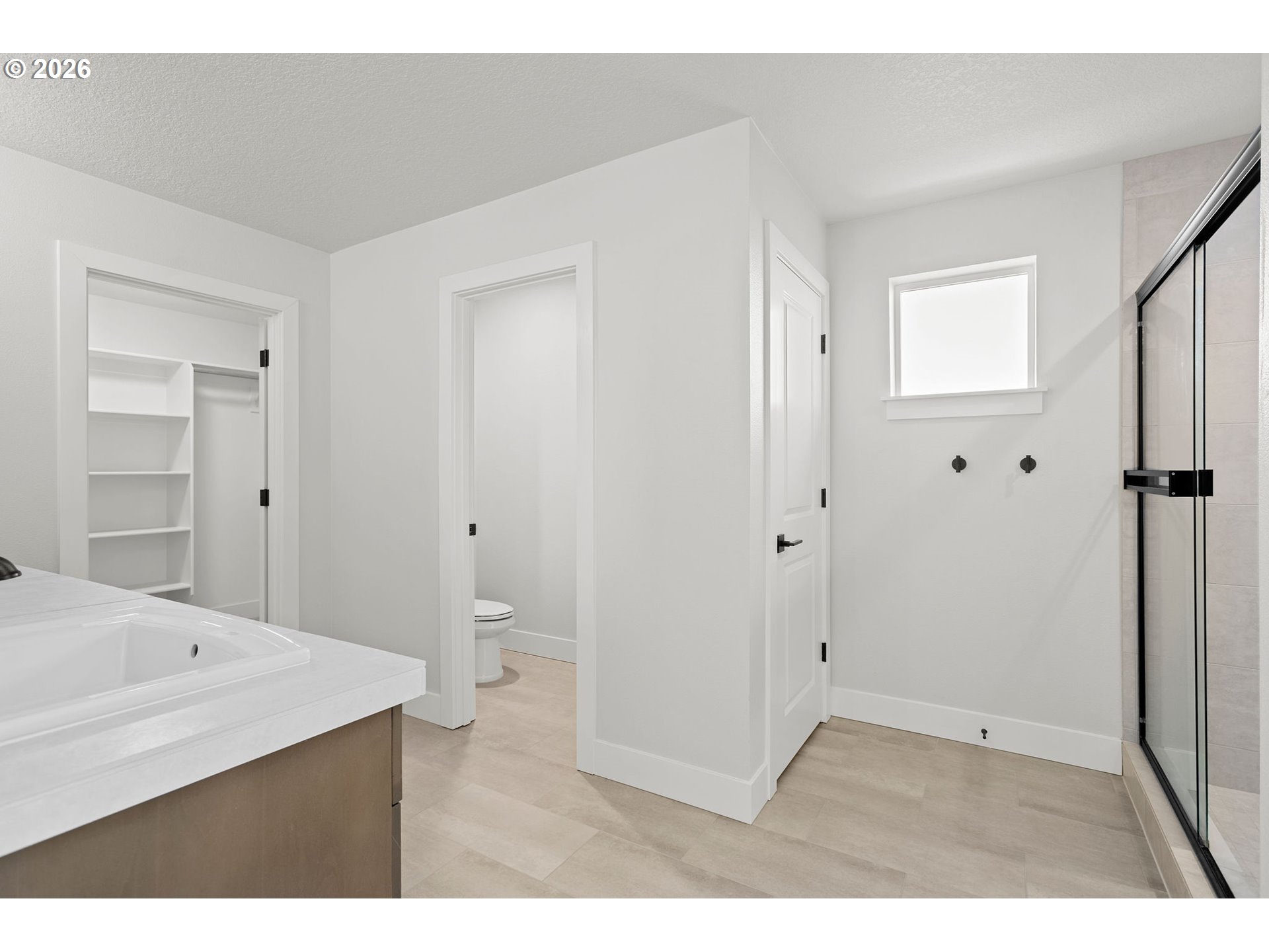 719 Northwest 178th Street Ridgefield, WA 98642 - Photo 27 of 46 a bathroom with a sink a toilet and shower