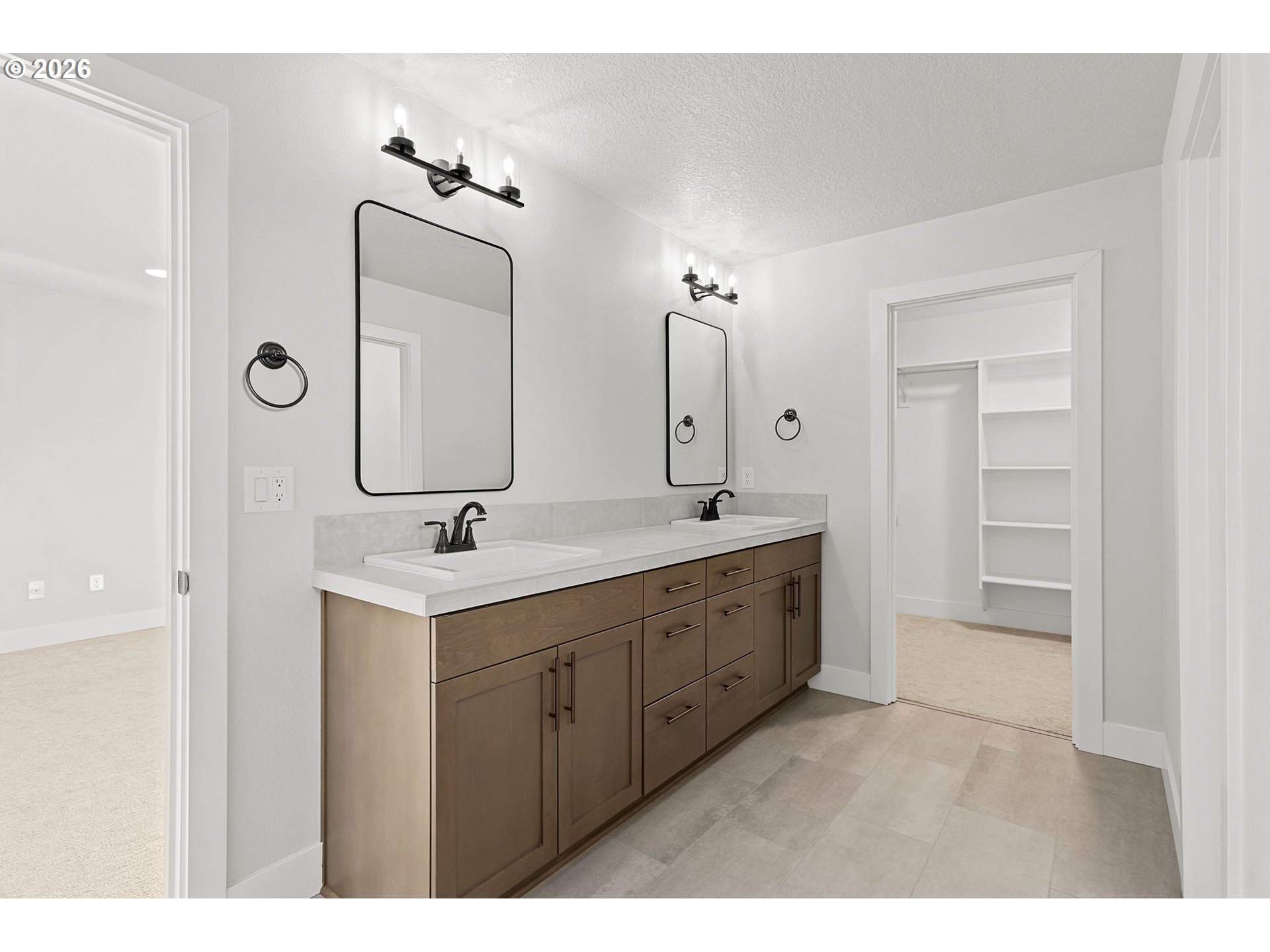 719 Northwest 178th Street Ridgefield, WA 98642 - Photo 29 of 46 a bathroom with a double vanity sink mirror and