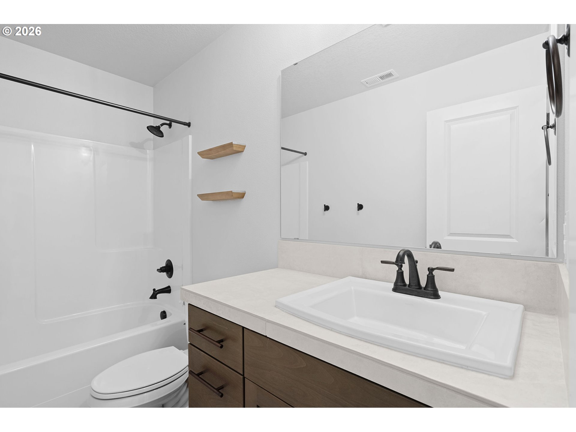 719 Northwest 178th Street Ridgefield, WA 98642 - Photo 41 of 46 a bathroom with a sink a toilet and a bathtub