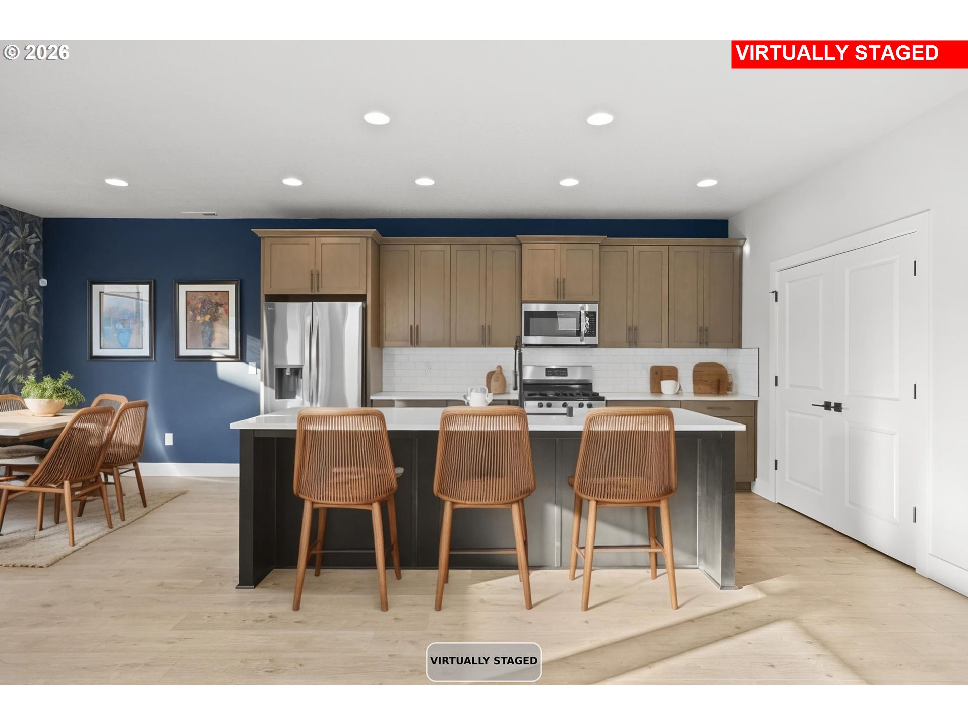 719 Northwest 178th Street Ridgefield, WA 98642 - Photo 10 of 46 a kitchen with a dining table chairs and granite counter tops