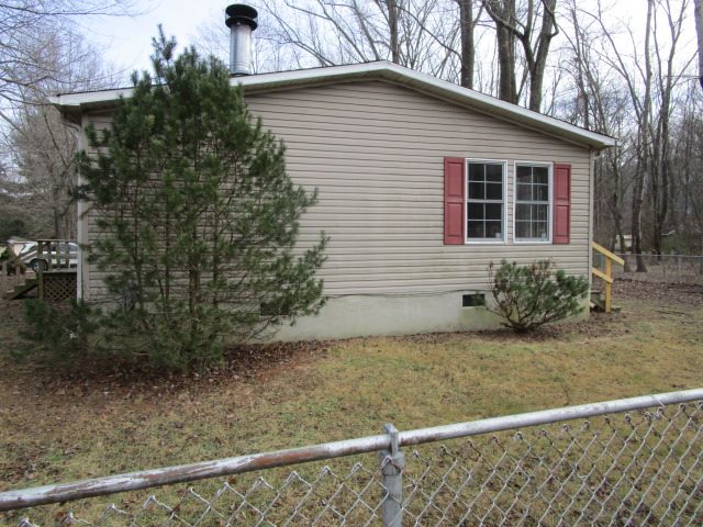 2160 Mt Torrey Road Lyndhurst, VA 22952 - Photo 14 of 16 a house with trees in front of it