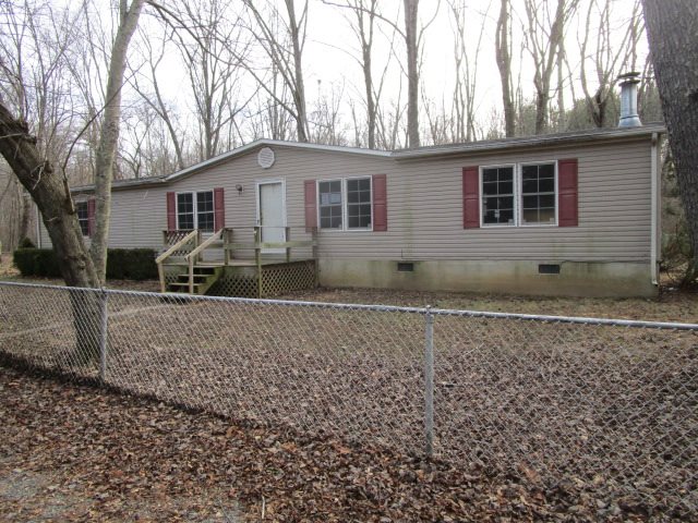 2160 Mt Torrey Road Lyndhurst, VA 22952 - Photo 2 of 16 a front view of a house with yard and trees in the background