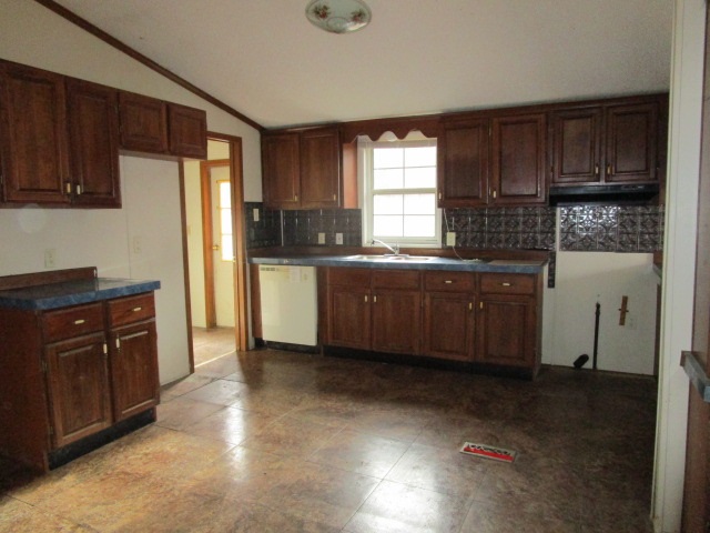 2160 Mt Torrey Road Lyndhurst, VA 22952 - Photo 3 of 16 a kitchen with stainless steel appliances granite countertop a refrigerator a sink dishwasher and wooden cabinets