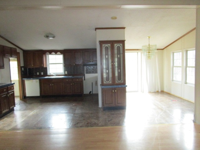 2160 Mt Torrey Road Lyndhurst, VA 22952 - Photo 4 of 16 a view of a kitchen with a sink and dishwasher a refrigerator with wooden floor