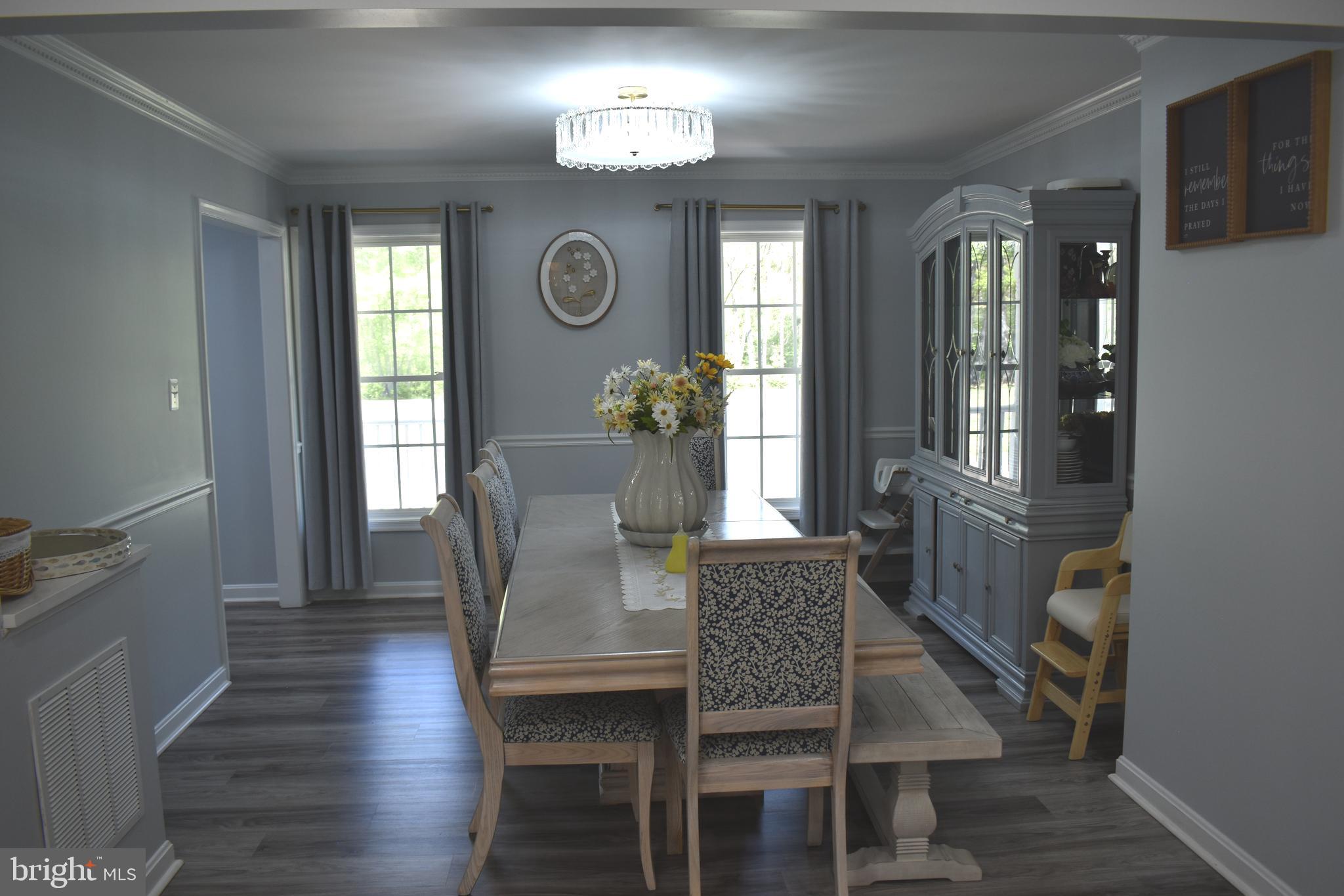 10958 Mountain Run Lake Road Culpeper, VA 22701 - Photo 13 of 31 a view of a dining room with furniture and a window