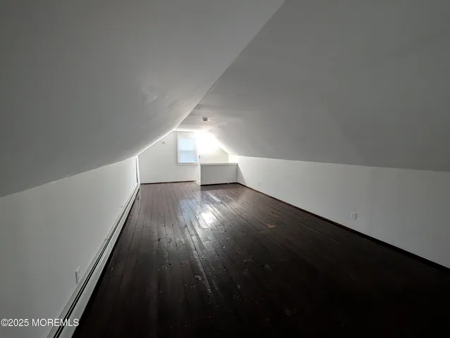 a view of wooden floor and staircase in a room