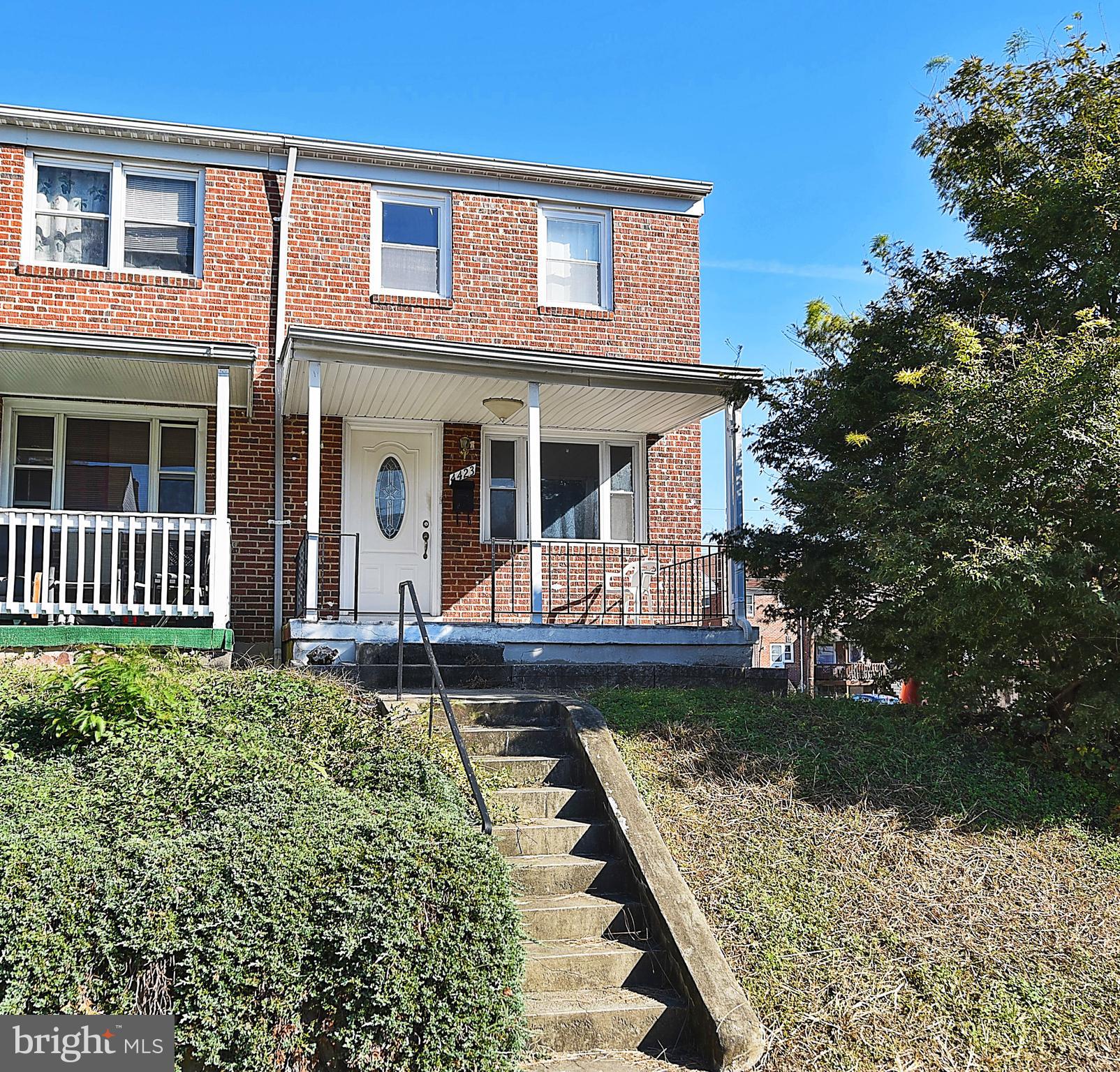 4423 Fenor Road Baltimore, MD 21227 - Photo 1 of 28 a front view of a house with garden