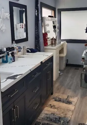 a bathroom with a sink and a mirror