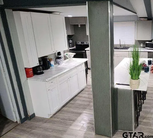 a room with sink a washer and dryer