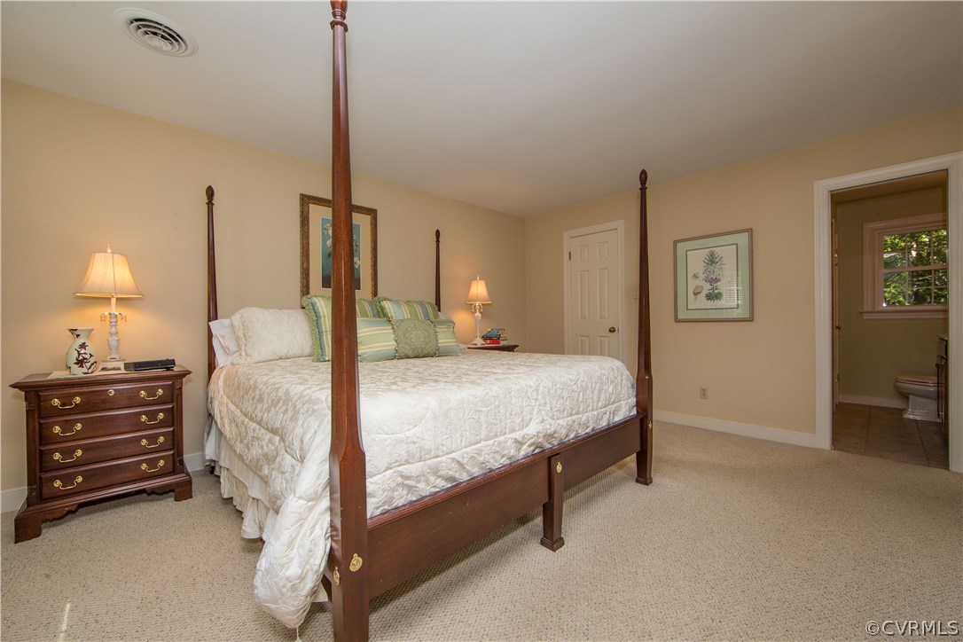 13124 Queensgate Road Midlothian, VA 23114 - Photo 20 of 50 a bedroom with a bed and dresser