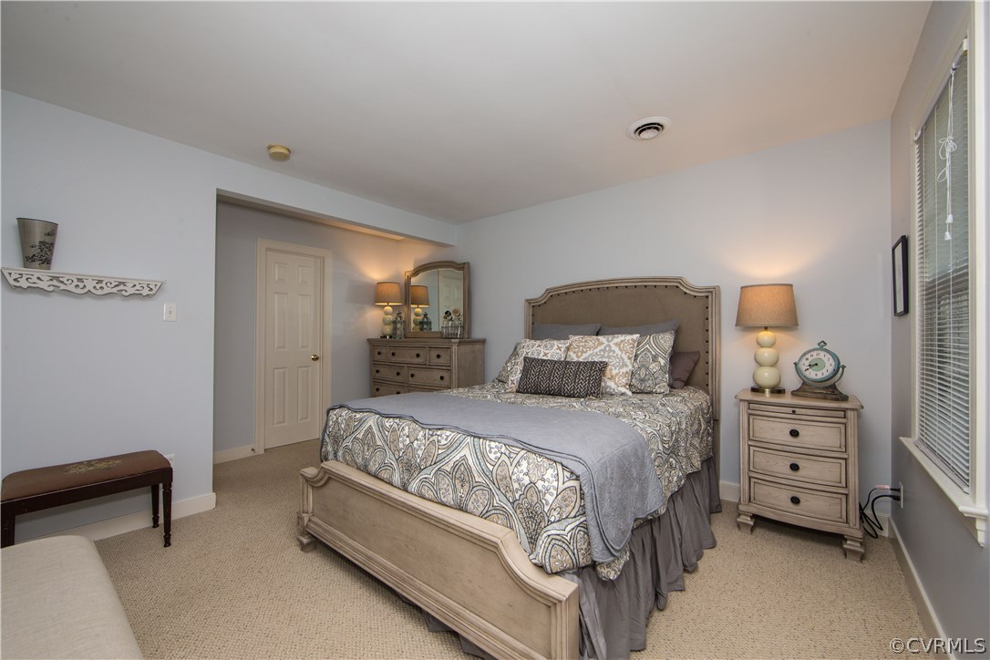 13124 Queensgate Road Midlothian, VA 23114 - Photo 24 of 50 a bedroom with a bed and a chair