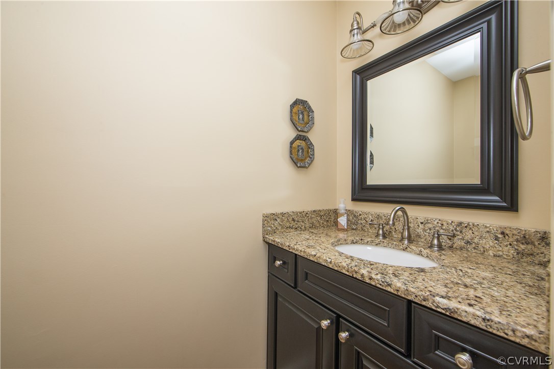 13124 Queensgate Road Midlothian, VA 23114 - Photo 31 of 50 a bathroom with a granite countertop sink and a mirror