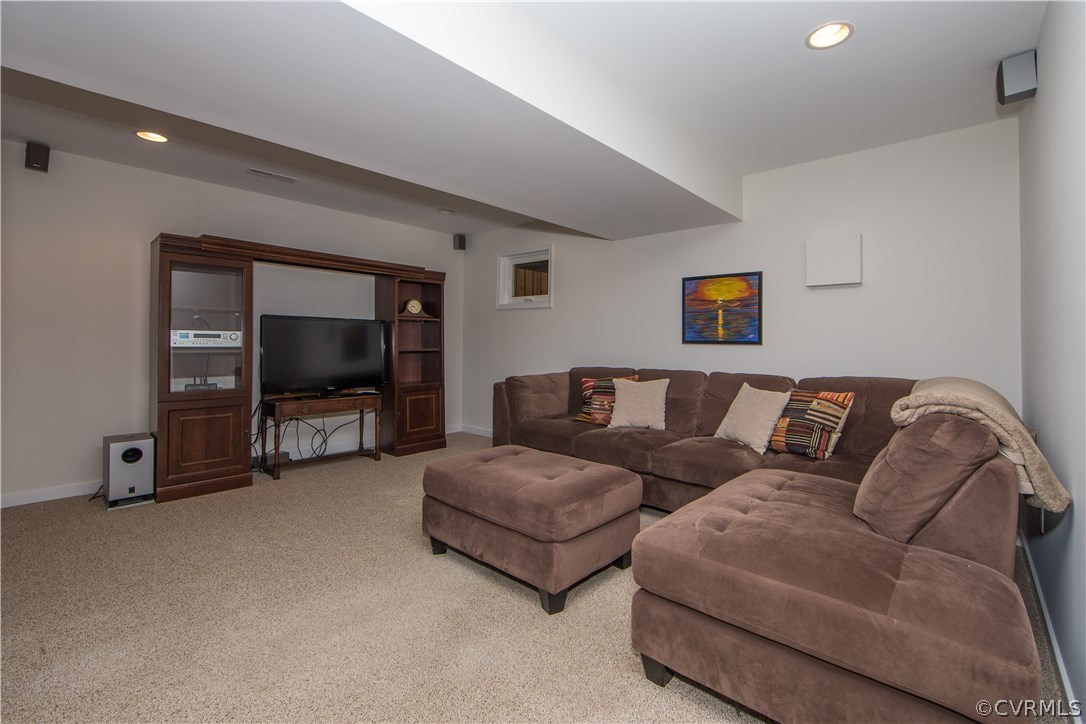 13124 Queensgate Road Midlothian, VA 23114 - Photo 39 of 50 a living room with furniture and a flat screen tv