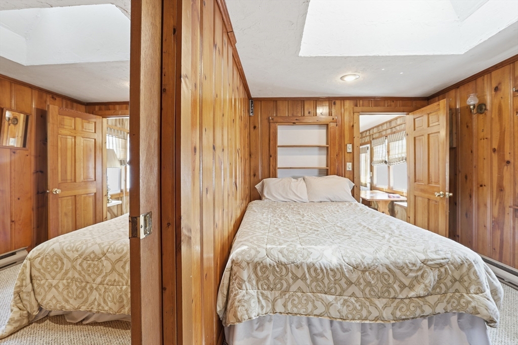 7 Swift Avenue Wareham, MA 02571 - Photo 19 of 42 a bedroom with a large bed and a large window