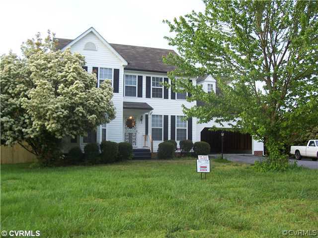 1208 Tree Ridge Road Henrico, VA 23231 - Photo 21 of 21 a front view of a house with a yard and a tree