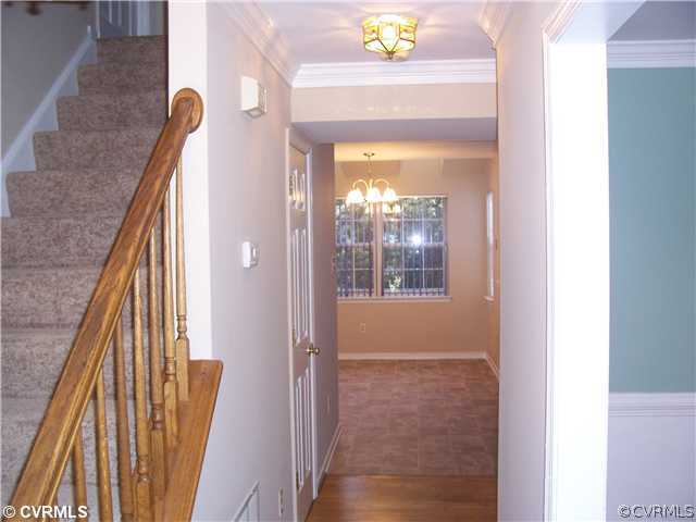 1208 Tree Ridge Road Henrico, VA 23231 - Photo 6 of 21 a view of a hallway with wooden floor and staircase