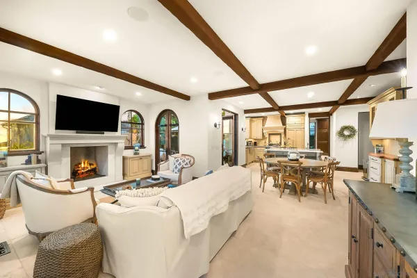 a backyard of a house with table and chairs