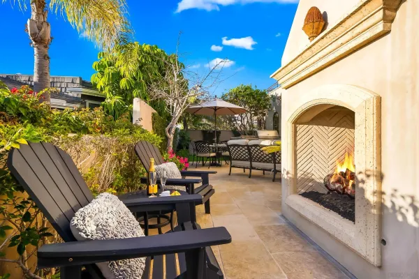 a view of a swimming pool with a patio and plants